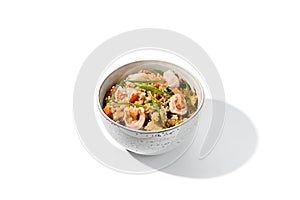 Fried rice with egg, shrimps and vegetables isolated on white background Traditional chinese food - fried rice with shrimps in