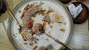 fried rice that is almost finished on the serving plate