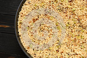 Fried rice with onions and zucchini in a pan