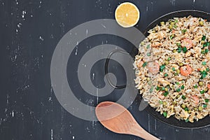 Fried rice with shrimp on the dark background