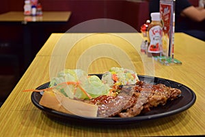 Fried rice with side dishes, steaks, dishes.