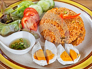 Fried rice with sweet chili sauce crispy slid fish and salted egg