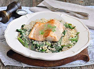 Fried salmon with brown rice, spinach and leguminous kidney bean photo