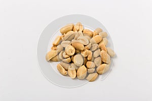 Fried salted peanuts on white background. snack.