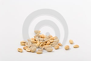 Fried salted peanuts on white background. snack.