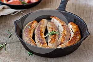 Fried sausages on a frying pan