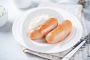 Fried sausages with rice in a plate