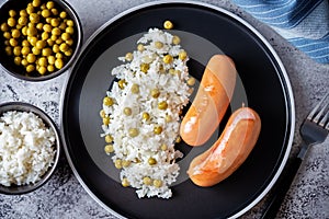 Fried sausages with rice in a plate