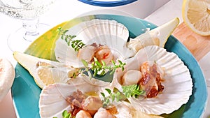 fried scallop, healthy gourmet food, seared scallops with caviar on on a beautiful dish in shellfish shells.