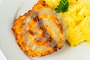 Fried schnitzel in breadcrumb and almond, mashed potato photo