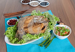 Fried sea perch topped with savory fish sauce menu