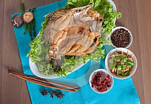 Fried sea perch topped with savory fish sauce menu