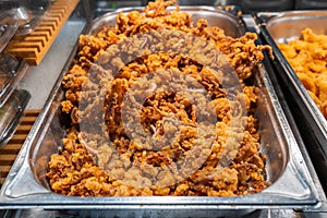 Fried seafood with batter for sale at food market