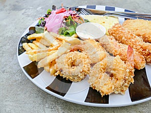 Fried seafood in plate with salad