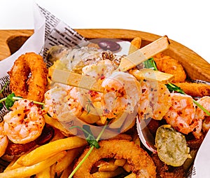 fried seafood plate on wooden tray