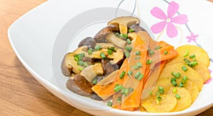 Fried Shiitake mushroom, carrot and potato with butter sauce