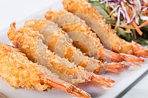 Fried shrimp with salad