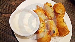 Fried shrimp springroll served with mayonaise.