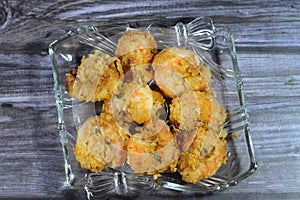 Fried shrimps covered with flour and fried in deep hot oil, shrimps are crustacean (a form of shellfish)