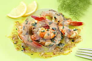 Fried shrimps on a plate with garlic