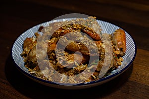 fried shrimps or prawns with garlic on white plate