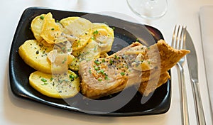 Fried skate wings and potatoes