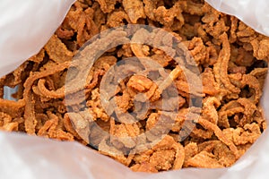 Fried slice pork in plastic bag