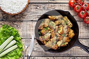 Fried sliced chicken or turkey fillet meat with fork, knife