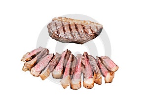 Fried and sliced Top sirloin steak, Grilled cup rump beef meat steak on a steel serving tray with spices. Isolated
