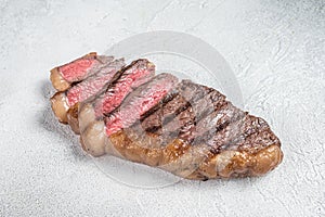 Fried and sliced Top sirloin steak, Grilled cup rump beef meat steak. White background. Top view. Copy space