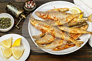 Fried smelt in a white plate. Small fish