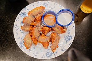 Fried spicy chicken and dipping sauces
