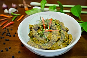 Fried spicy pork boar with herbs, traditional Thai cuisine dish with many herbs