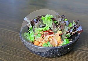 Fried spicy salmon salad mixed vegetable and herb