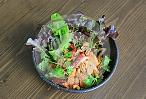 Fried spicy salmon salad mixed vegetable and herb