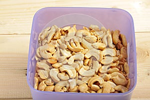 Fried splited cashews on a wooden table