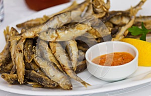 Fried sprat with souce photo