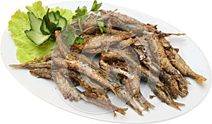 Fried sprats with lettuce photo
