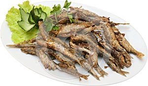 Fried sprats with lettuce
