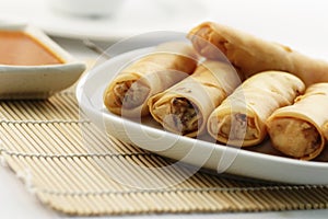 Fried spring rolls or popiah with sauce