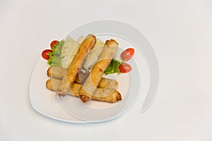 Fried spring rolls with red and white sauces. Deep fried spring roll with sauce on white plate. Crispy spring rolls on dish with v