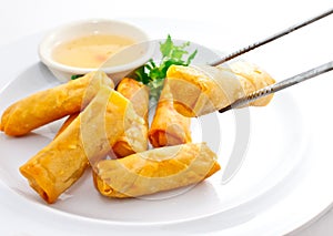 Fried springrolls with chopsticks