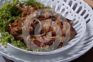 Fried squid with garlic in a semic dish