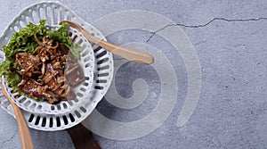 Fried squid with garlic in a semic dish.copy space