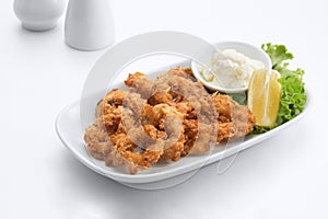 fried squid rings on white background.