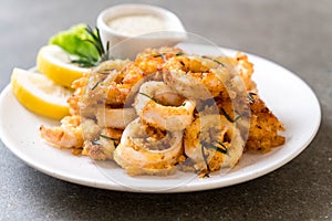 fried squids or octopus (calamari) with sauce