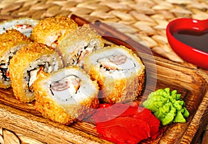 Fried tempura sushi rolls set close up selective focus. Japanese traditional fusion food style, restaurant menu