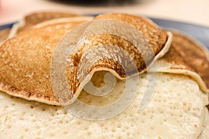 Fried thin pancakes made from wheat flour close up Photo