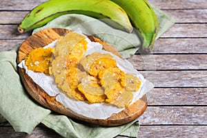 Fried tostones, green plantains, bananas with guacamole sauce