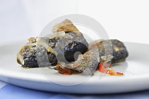 Fried trout with onion and pepper